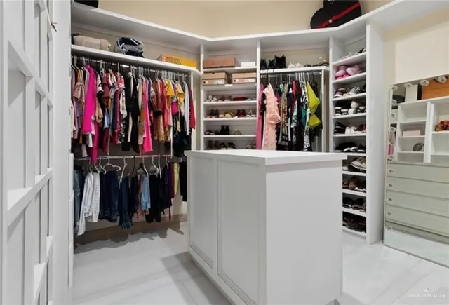a bathroom with a sink double vanity and a mirror