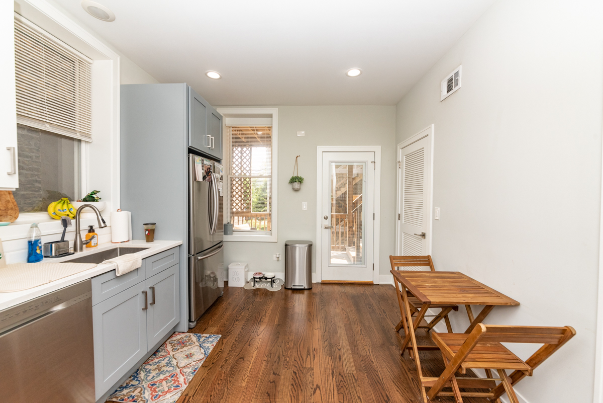 2145 West Webster Avenue, Unit 2 Chicago, IL 60647 - Photo 3 of 13 a spacious bathroom with a double vanity sink a mirror and a shower