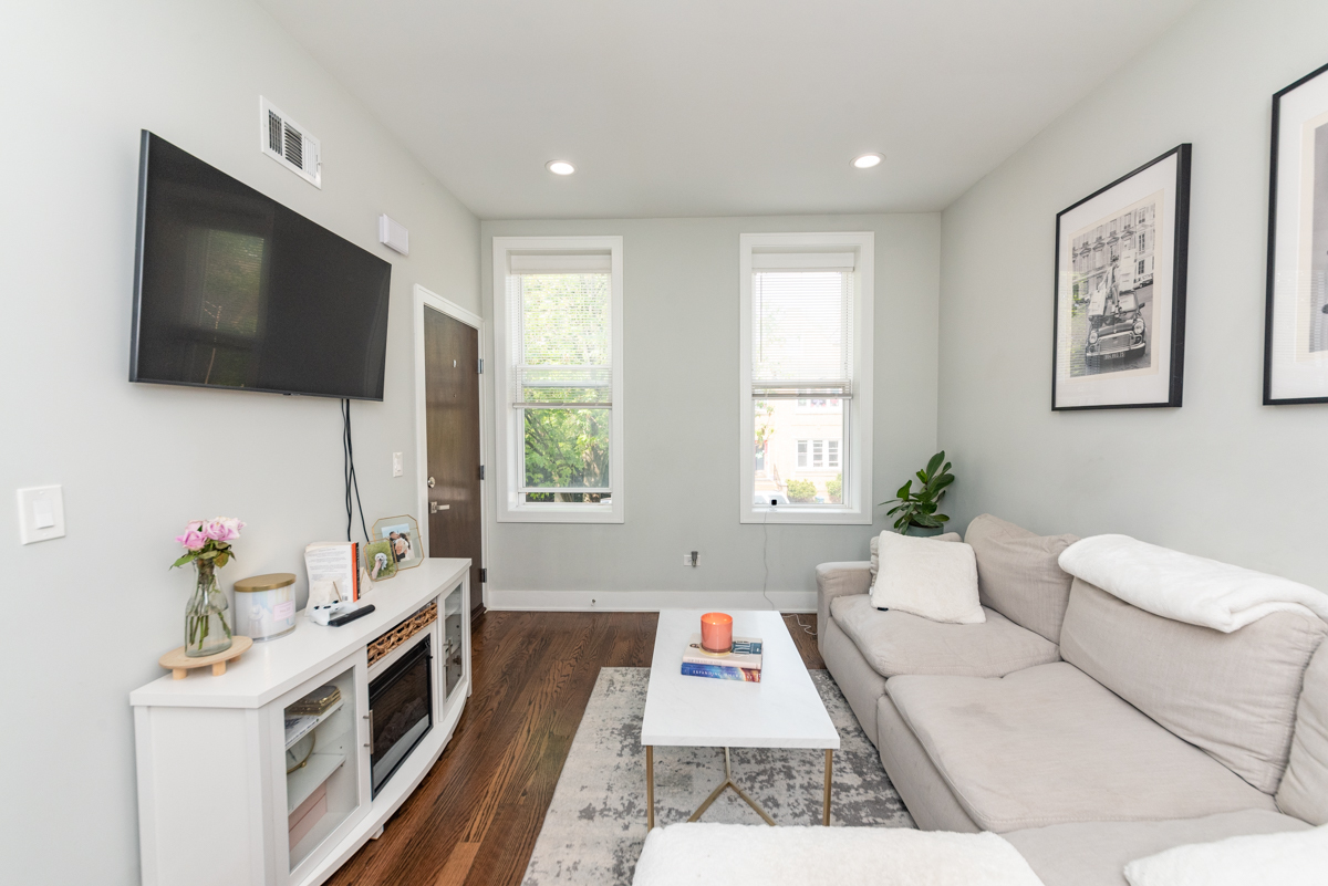 2145 West Webster Avenue, Unit 2 Chicago, IL 60647 - Photo 4 of 13 a living room with furniture and a flat screen tv