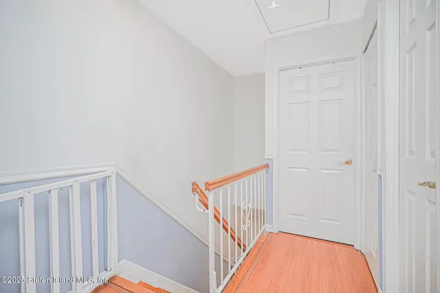 a view of a hallway with stairs