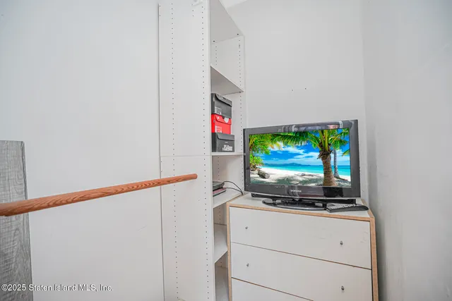 a living room with flat screen tv