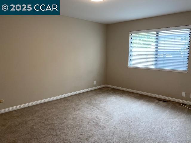 1220 Walker Avenue, Unit 3 Walnut Creek, CA 94596 - Photo 14 of 26 an empty room with a window