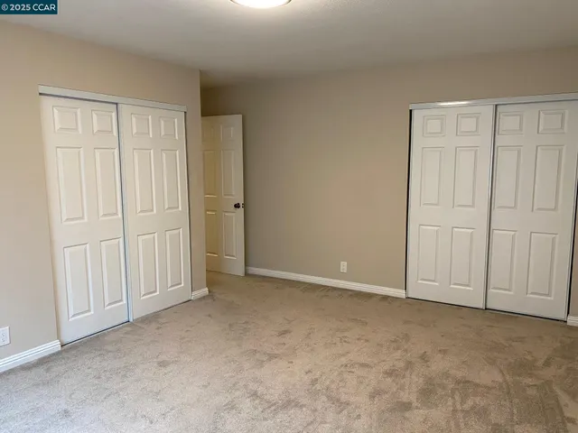 a view of an empty room with entryway
