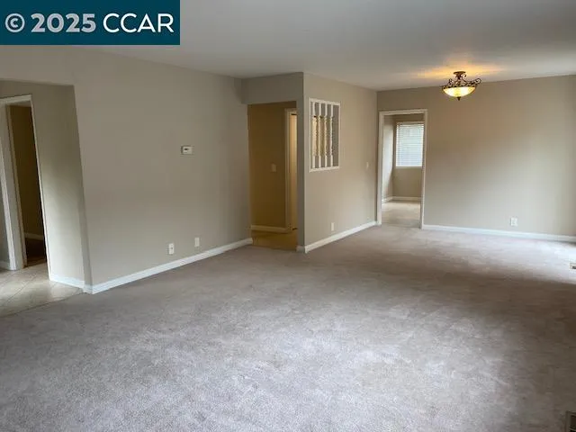 a view of an empty room and window