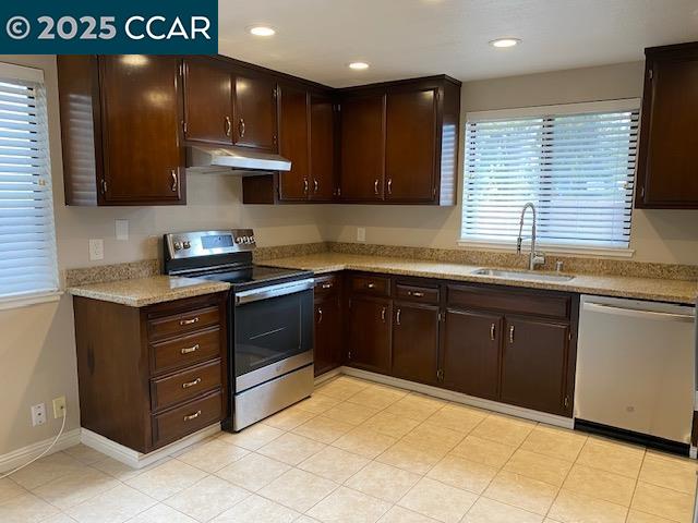 1220 Walker Avenue, Unit 3 Walnut Creek, CA 94596 - Photo 6 of 26 a kitchen with stainless steel appliances granite countertop a sink and cabinets
