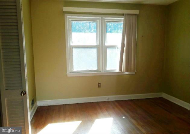 500 Blick Drive Silver Spring, MD 20904 - Photo 2 of 15 a view of a room that has wooden floor and a window