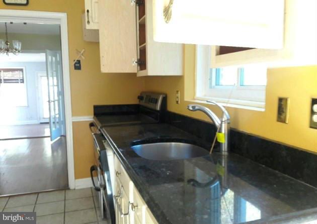 500 Blick Drive Silver Spring, MD 20904 - Photo 4 of 15 a kitchen with stainless steel appliances granite countertop a sink and a refrigerator