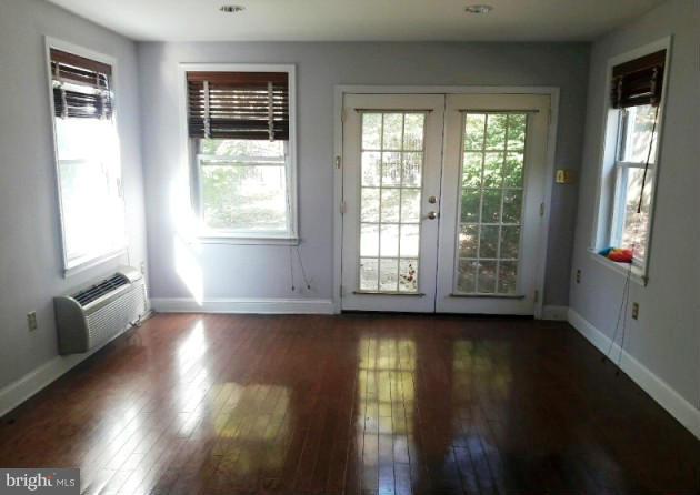 500 Blick Drive Silver Spring, MD 20904 - Photo 10 of 15 a view of an empty room with wooden floor and a window