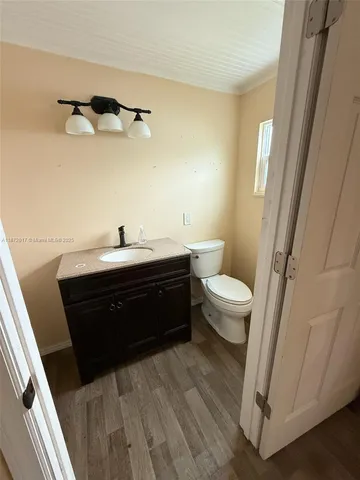 a room with a sink and a toilet