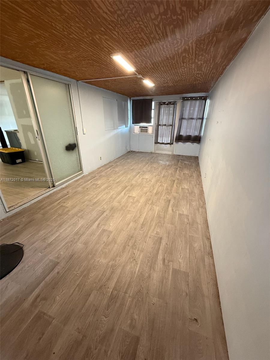 5374 Southeast Celestial Circle Stuart, FL 34997 - Photo 18 of 23 a view of empty room with wooden floor