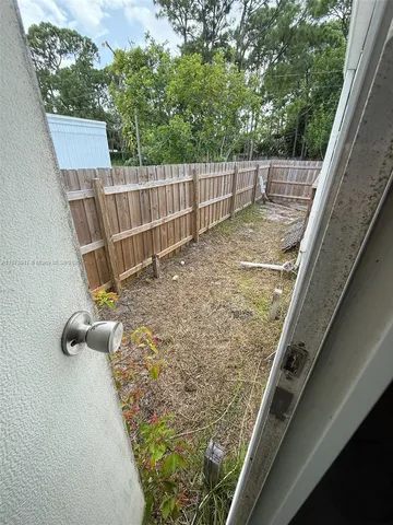 a view of a back yard of the house