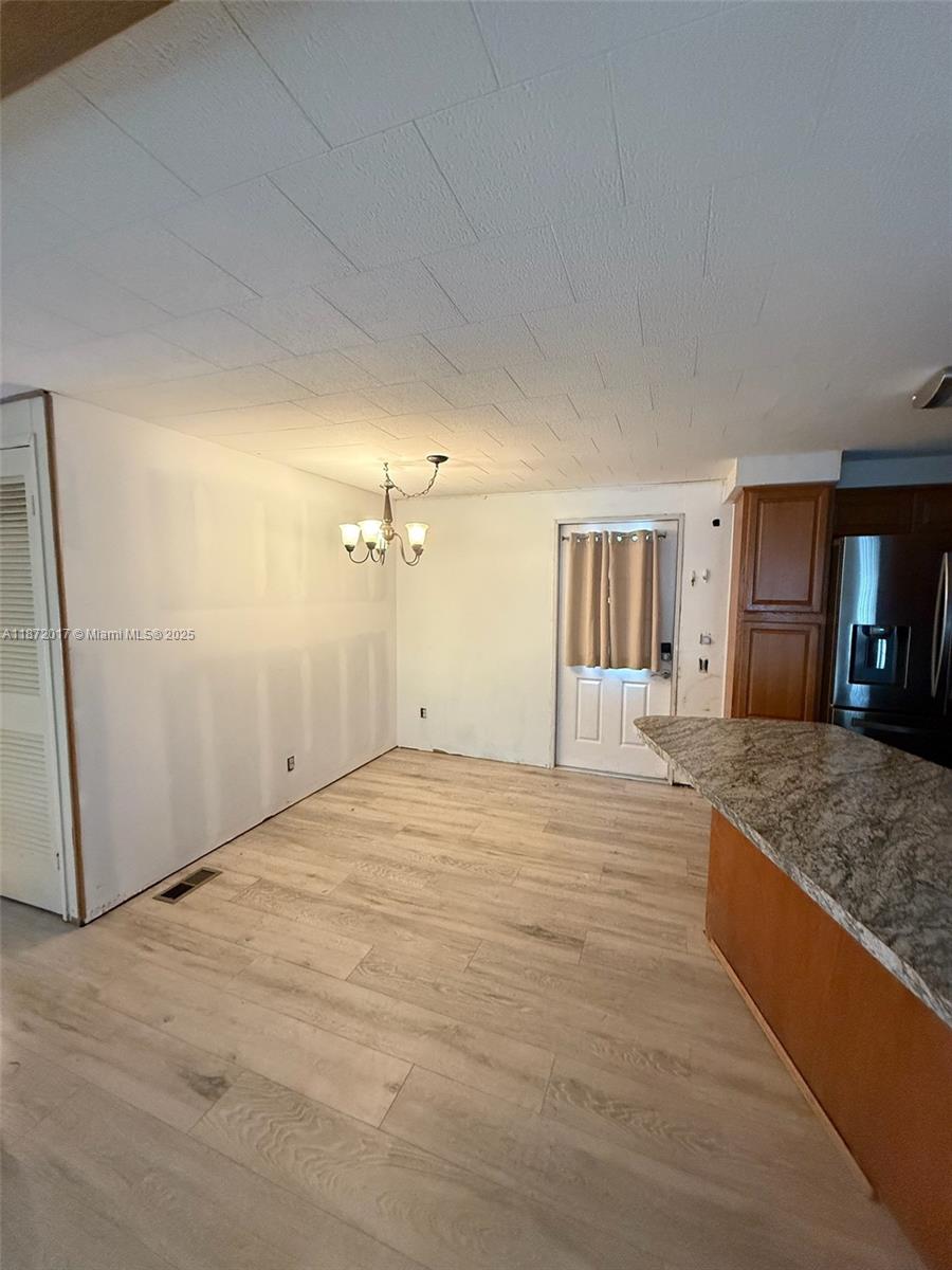 5374 Southeast Celestial Circle Stuart, FL 34997 - Photo 5 of 23 a view of a kitchen with a sink and cabinets