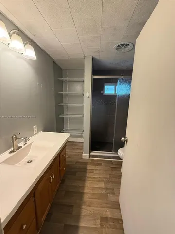 a bathroom with a sink and mirror