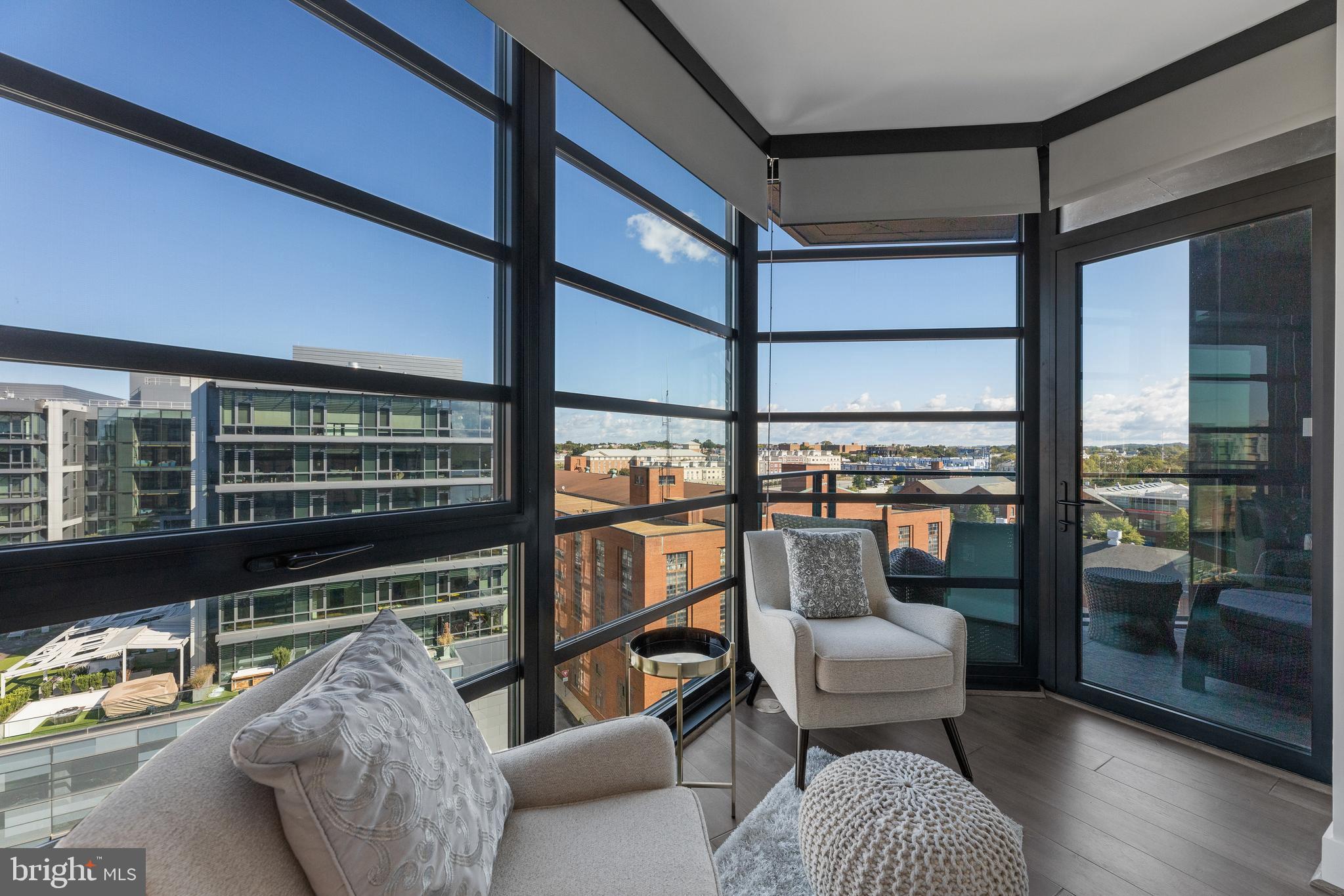 1300 4th Street Southeast, Unit 915 Washington, DC 20003 - Photo 11 of 34 a balcony with furniture and a potted plant