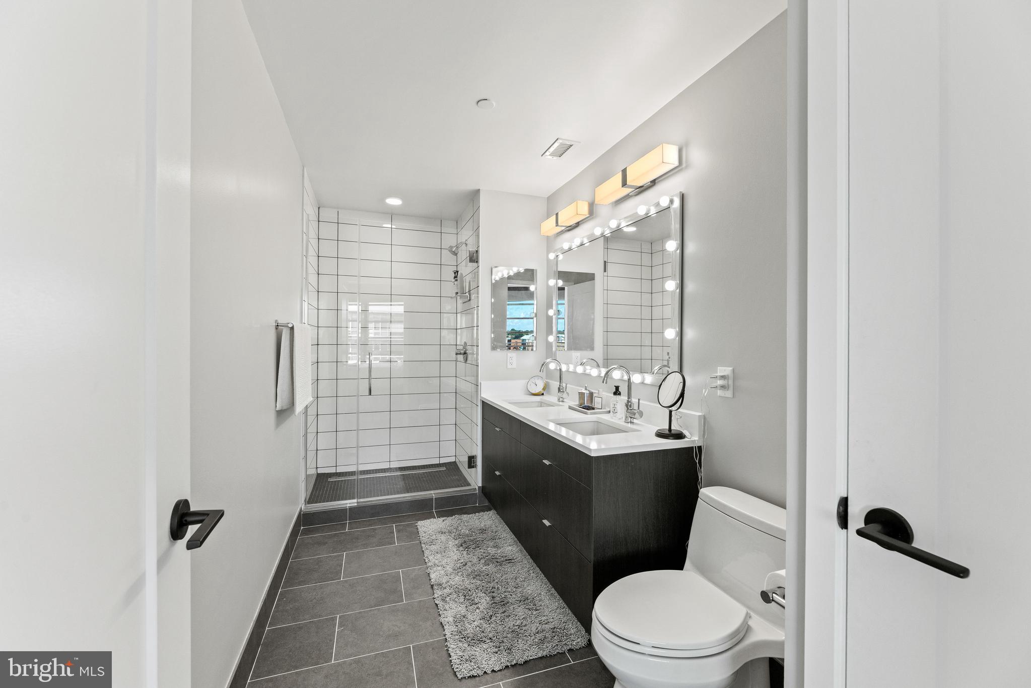 1300 4th Street Southeast, Unit 915 Washington, DC 20003 - Photo 12 of 34 a bathroom with a sink toilet and shower