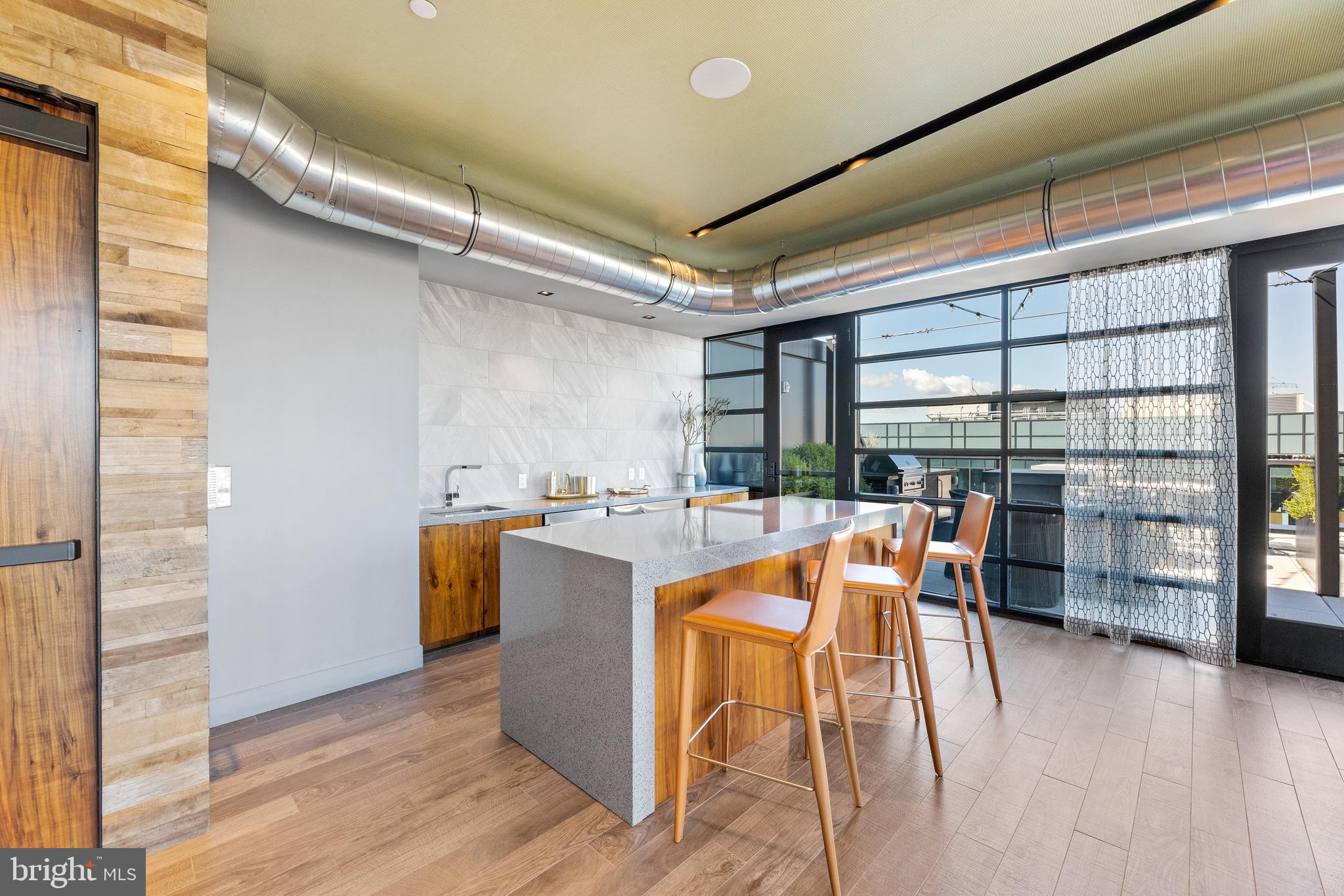 1300 4th Street Southeast, Unit 915 Washington, DC 20003 - Photo 25 of 34 a dining room with furniture and a floor to ceiling window