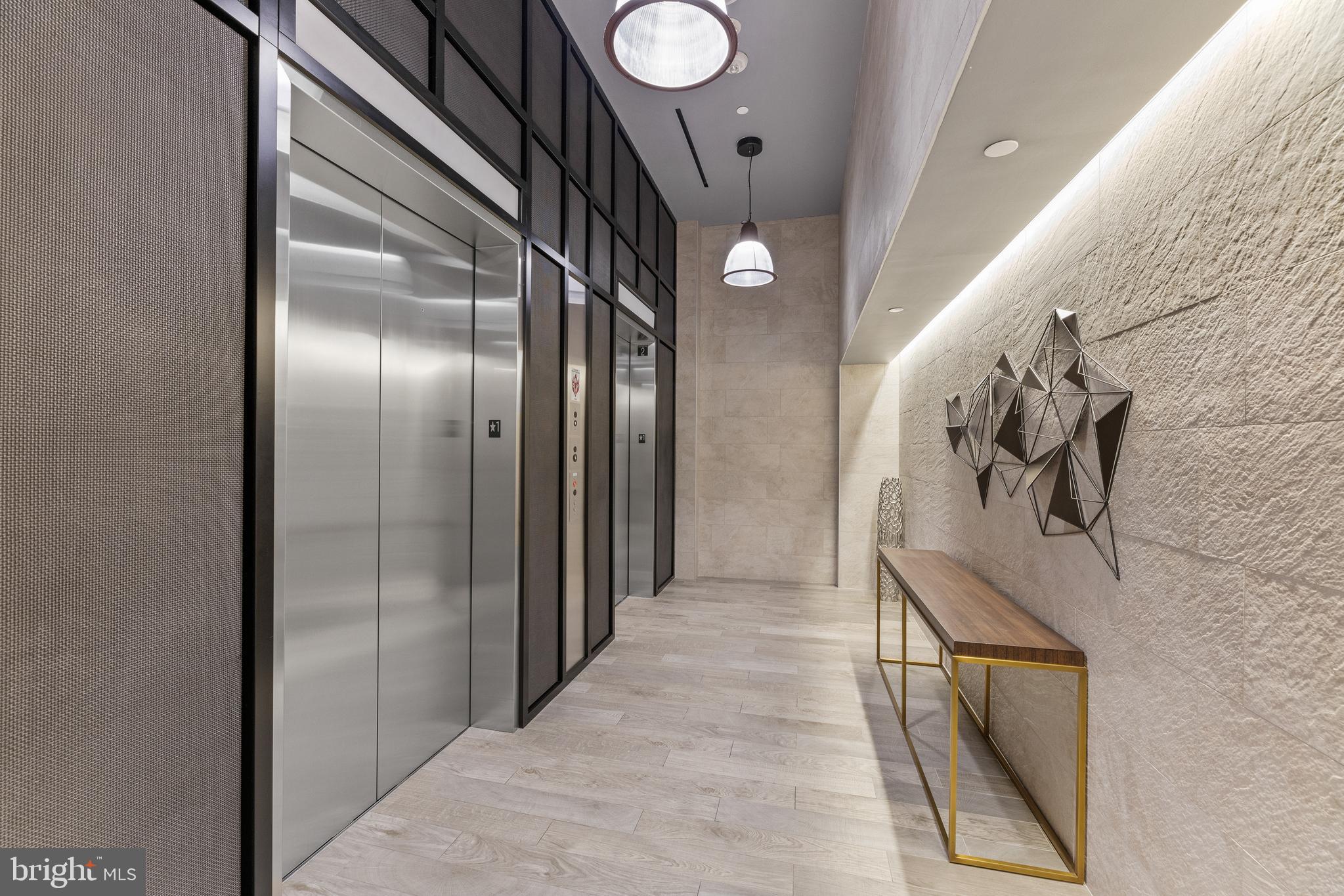 1300 4th Street Southeast, Unit 915 Washington, DC 20003 - Photo 30 of 34 a view of a hallway with wooden floor