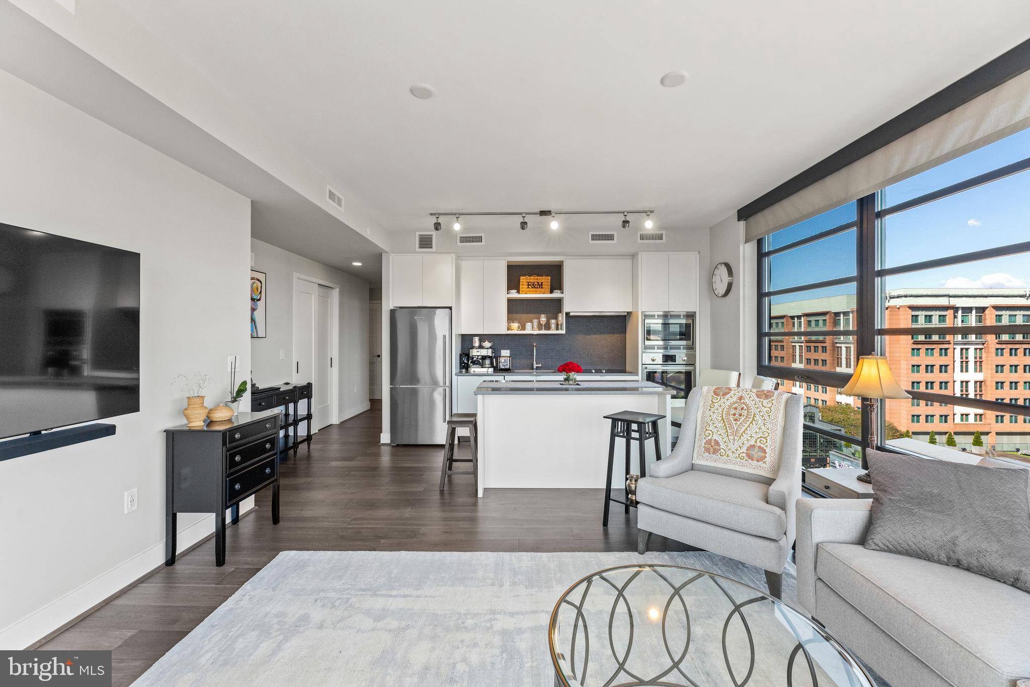 1300 4th Street Southeast, Unit 915 Washington, DC 20003 - Photo 4 of 34 a living room with furniture and a flat screen tv