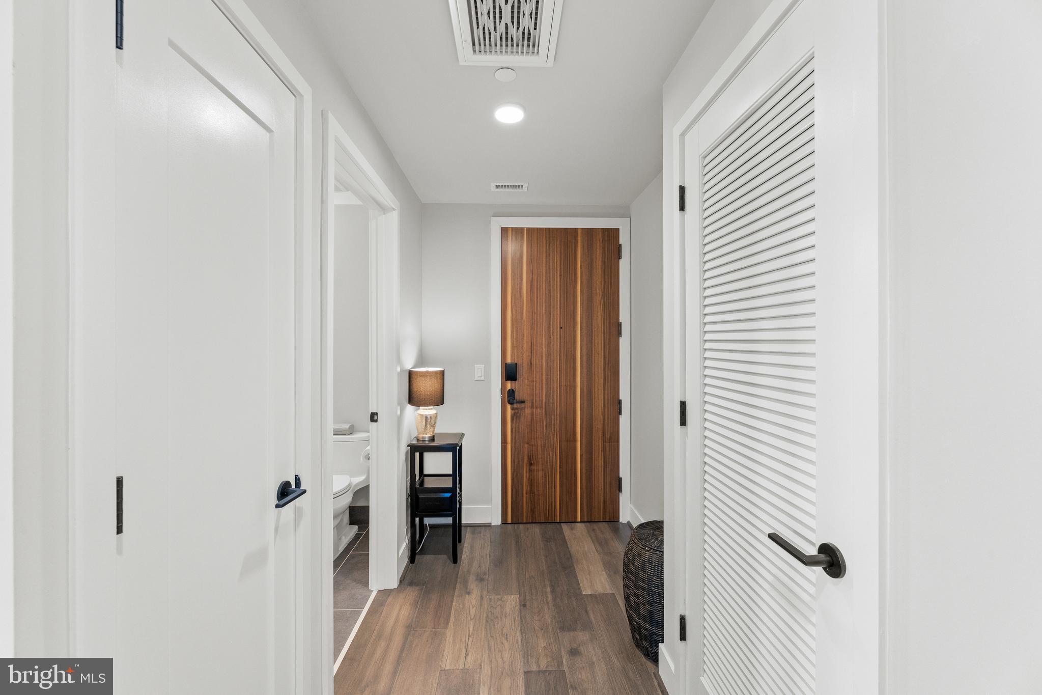1300 4th Street Southeast, Unit 915 Washington, DC 20003 - Photo 7 of 34 a view of a hallway with a wooden floor