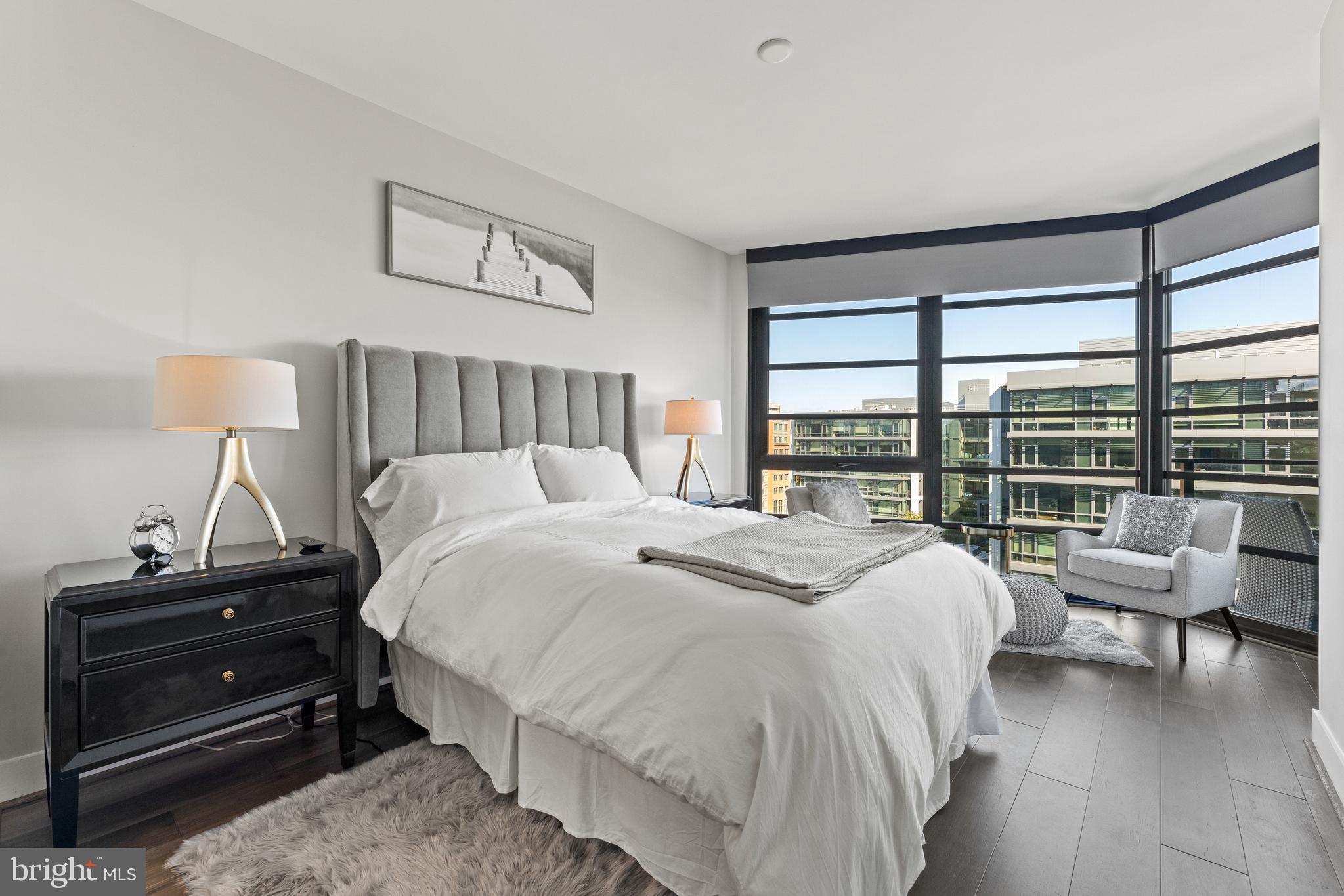 1300 4th Street Southeast, Unit 915 Washington, DC 20003 - Photo 8 of 34 a bedroom with a bed and a large window