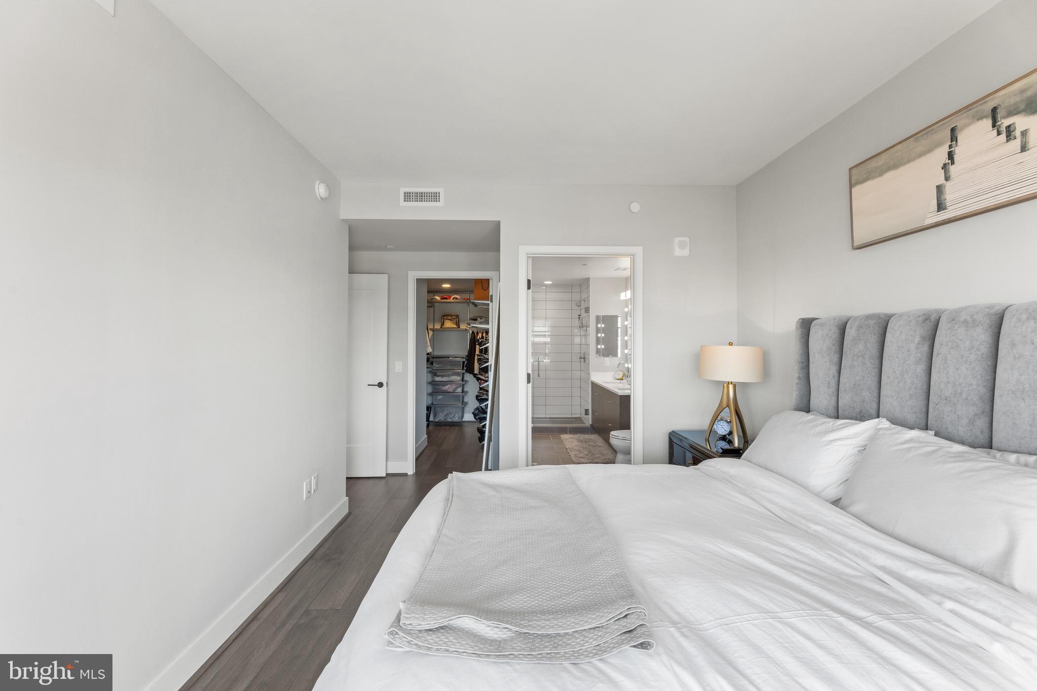 1300 4th Street Southeast, Unit 915 Washington, DC 20003 - Photo 10 of 34 a bedroom with a bed and painting on the wall