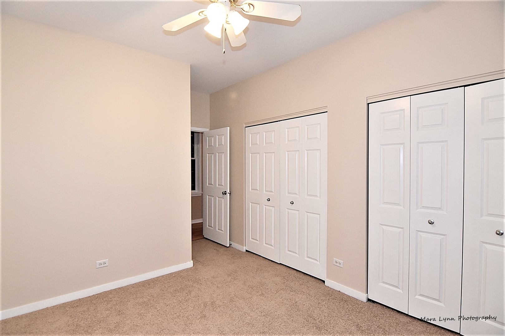 1311 West Fillmore Street, Unit B Chicago, IL 60607 - Photo 13 of 25 an empty room with a chandelier fan