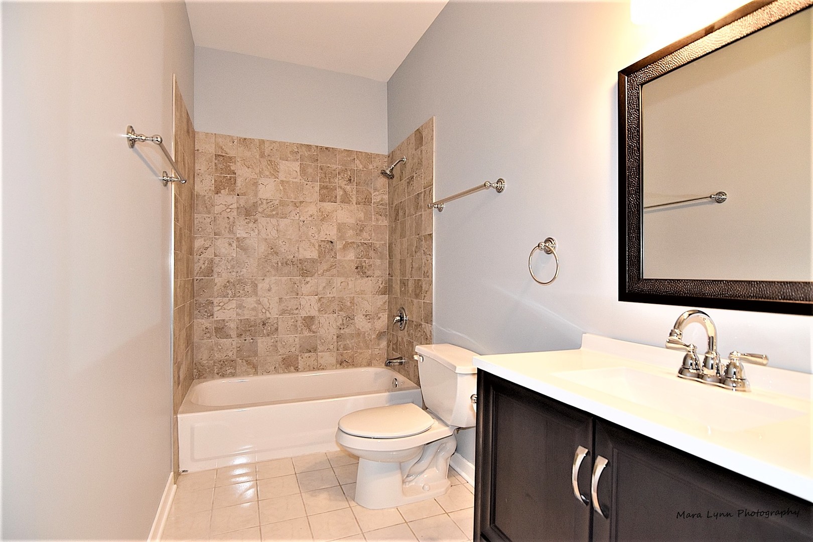 1311 West Fillmore Street, Unit B Chicago, IL 60607 - Photo 14 of 25 a bathroom with a sink a toilet and shower