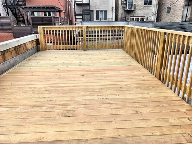 1311 West Fillmore Street, Unit B Chicago, IL 60607 - Photo 22 of 25 a view of a balcony with wooden floor