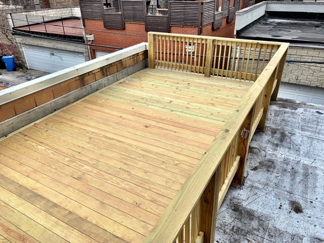 1311 West Fillmore Street, Unit B Chicago, IL 60607 - Photo 23 of 25 a balcony with wooden floor