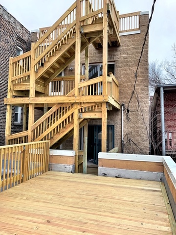 1311 West Fillmore Street, Unit B Chicago, IL 60607 - Photo 24 of 25 a view of a building with many windows