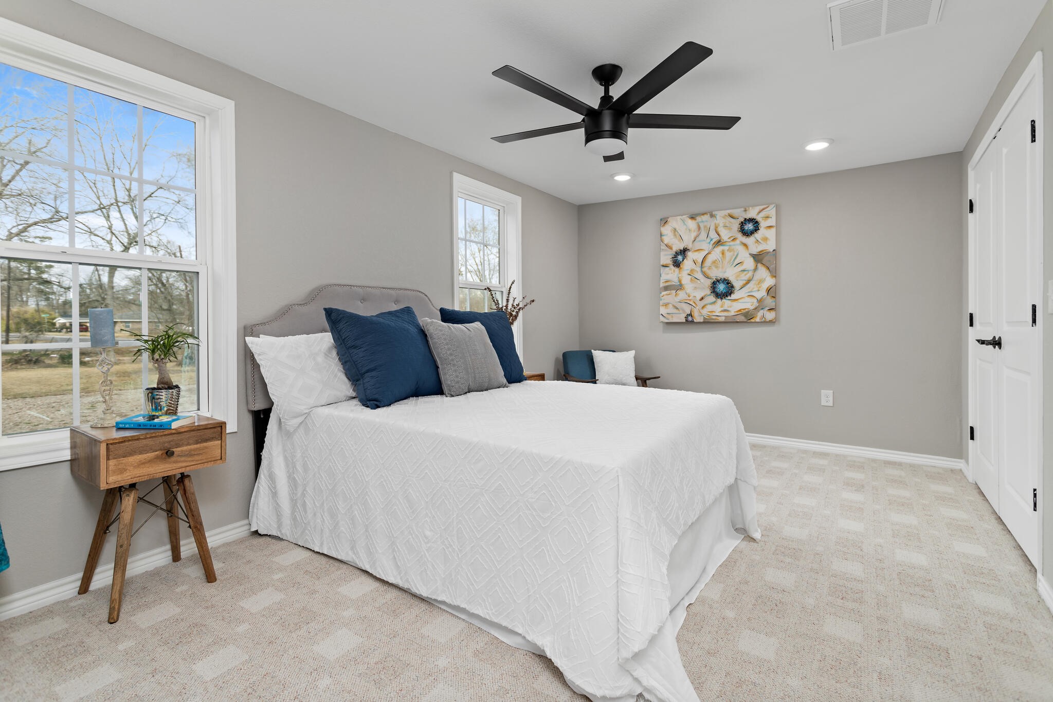 2320 Delaware Street Beaumont, TX 77703 - Photo 14 of 27 a bedroom with a large bed and a window