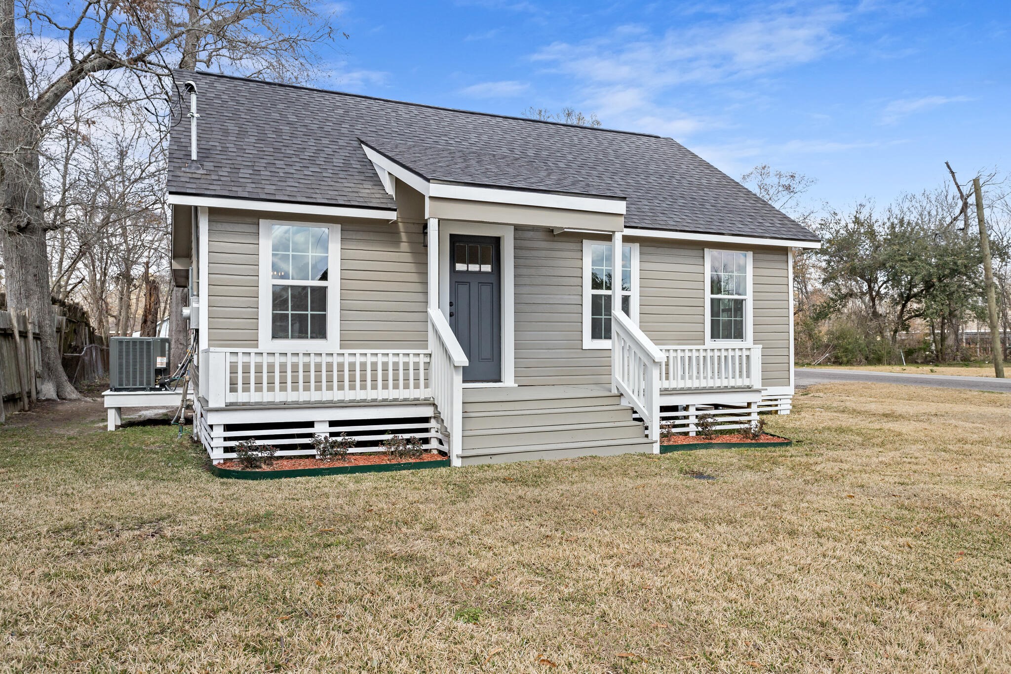 2320 Delaware Street Beaumont, TX 77703 - Photo 3 of 27 front view of a house with a bench