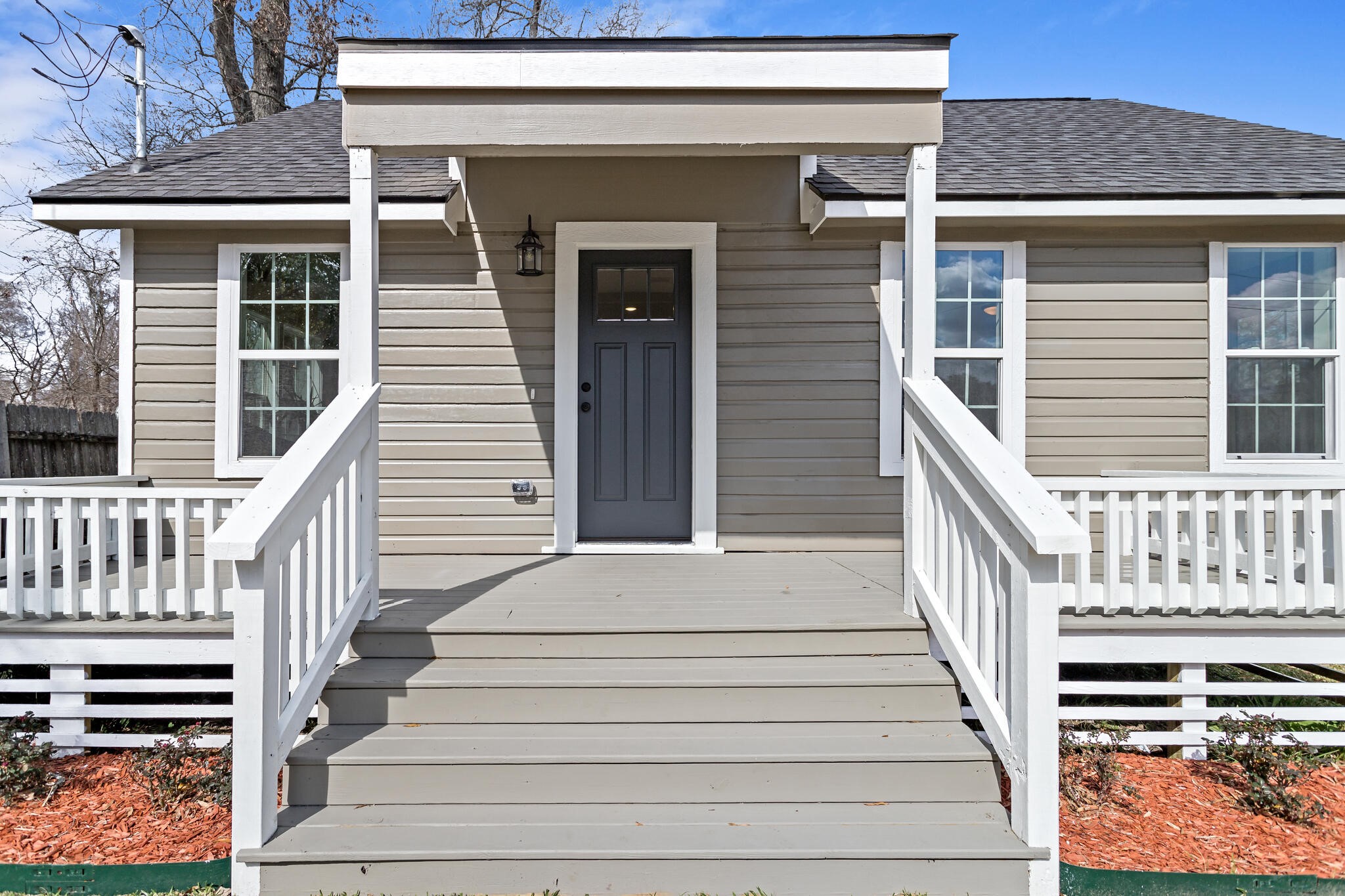 2320 Delaware Street Beaumont, TX 77703 - Photo 4 of 27 a view of a house with wooden stairs and a window