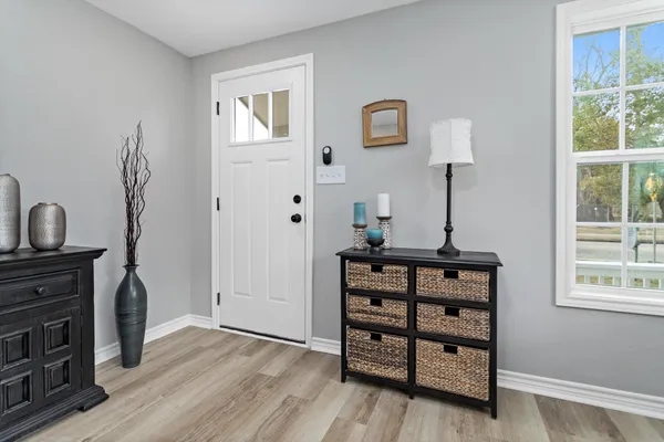 a view of room with furniture and wooden floor