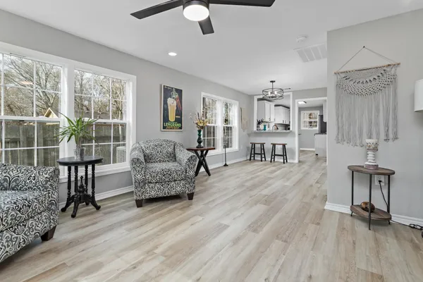 a living room with furniture and a large window