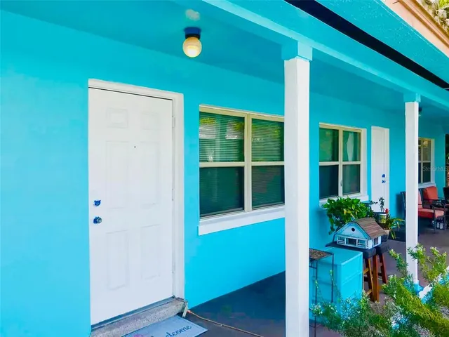 a living room that has a flat screen tv and a window