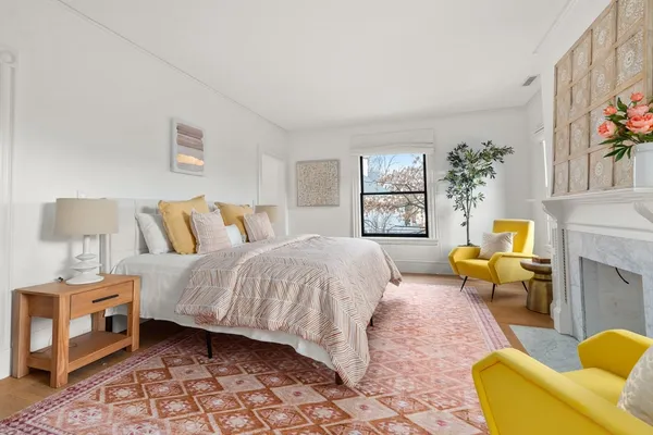a bedroom with a bed and a couch