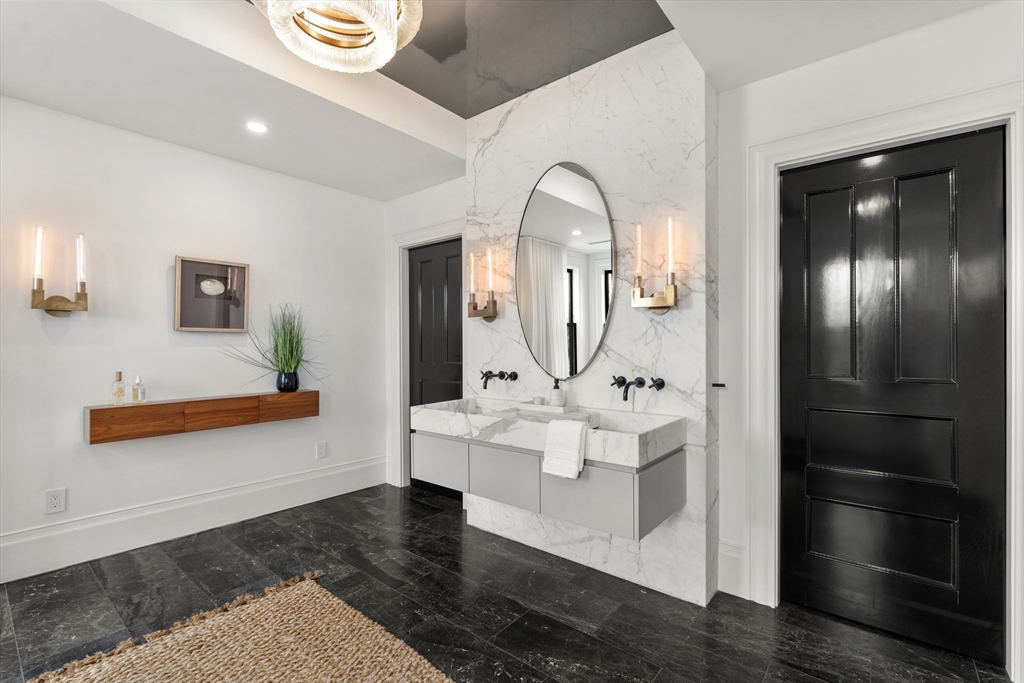 12 Martin Street Cambridge, MA 02138 - Photo 22 of 38 a en suite bathroom with a double vanity sink and a mirror