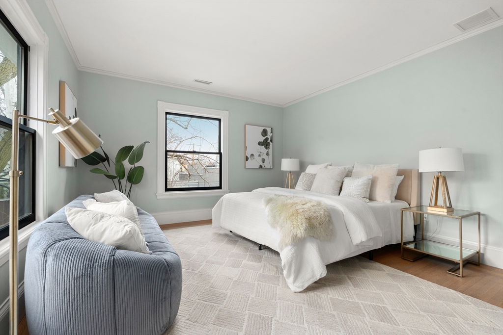 12 Martin Street Cambridge, MA 02138 - Photo 25 of 38 a spacious bedroom with two beds and a window