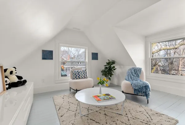 a living room with furniture and window
