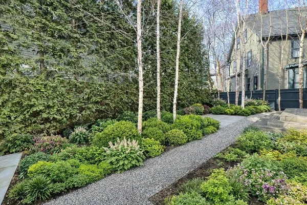 a view of a building with a yard