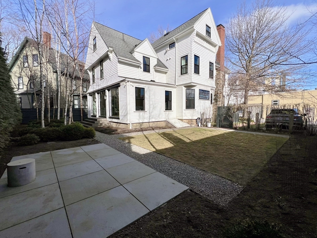 12 Martin Street Cambridge, MA 02138 - Photo 36 of 38 a view of a white house with a yard