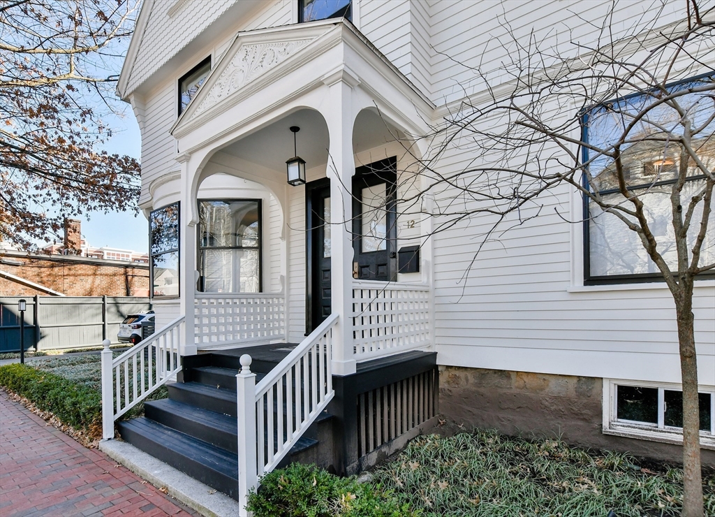 12 Martin Street Cambridge, MA 02138 - Photo 37 of 38 a view of a house with wooden deck and a tree