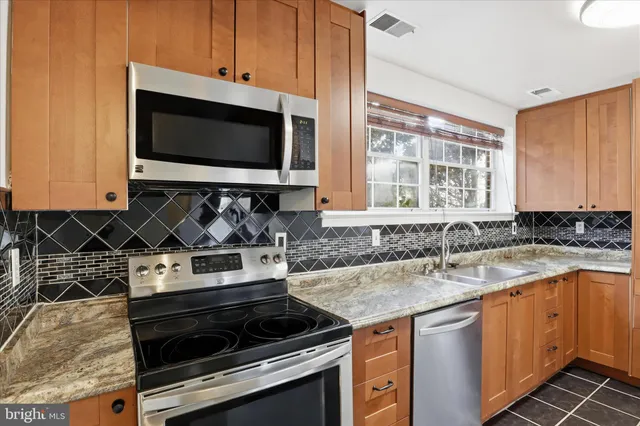 a kitchen with a stove and a microwave
