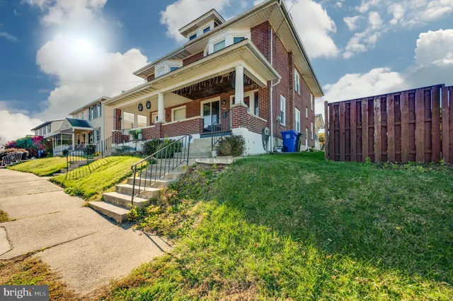 a view of a building with a yard