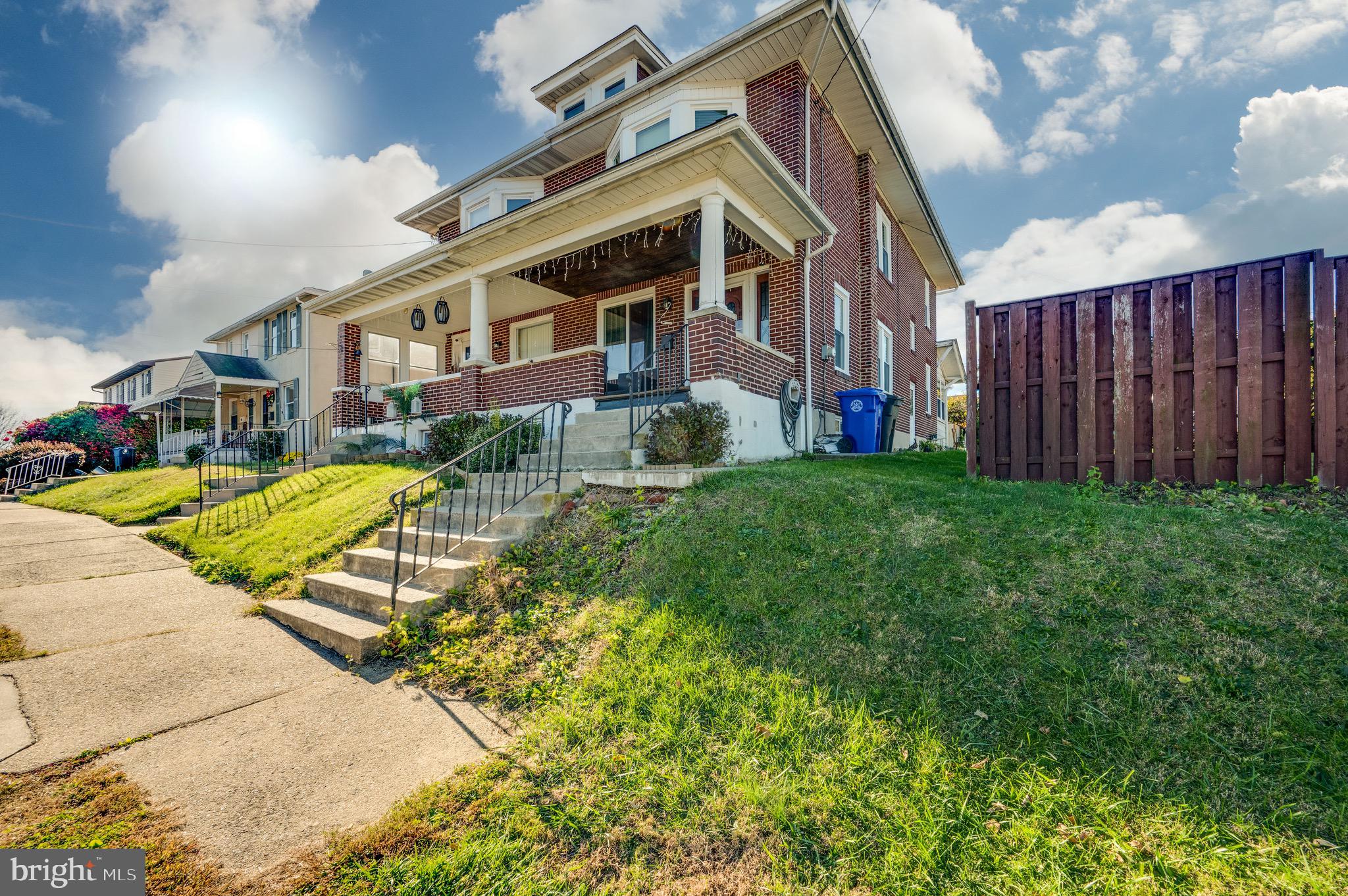 a view of a building with a yard