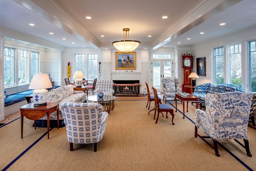 23 University Lane Manchester, MA 01944 - Photo 12 of 40 a living room with fireplace furniture and a large window
