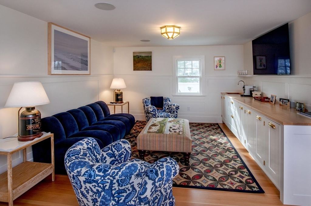 23 University Lane Manchester, MA 01944 - Photo 19 of 40 a living room with furniture rug and a window