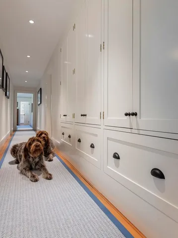 a bathroom with a granite countertop sink a toilet and a tub