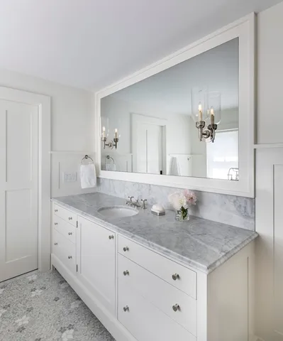 a bedroom with a bed and a fireplace